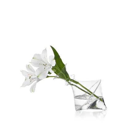 A white flower in a Mouth Blown Clear Vase - Exclusively at Hester &amp; Cook on a white surface.