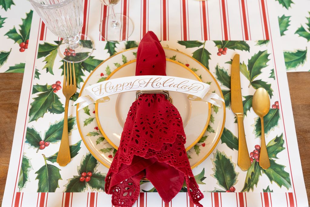 Christmas-themed place setting with a red napkin and &