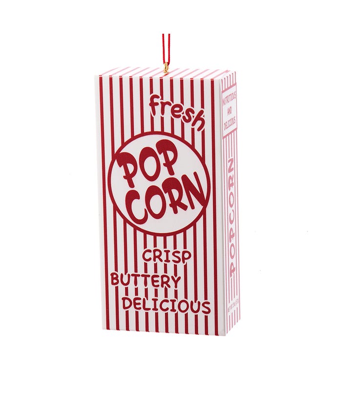 A red and white striped popcorn box ornament on a white background.