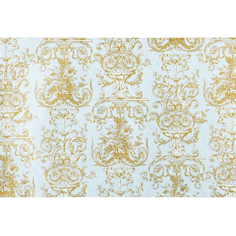 Decorative gold pattern on a light blue background