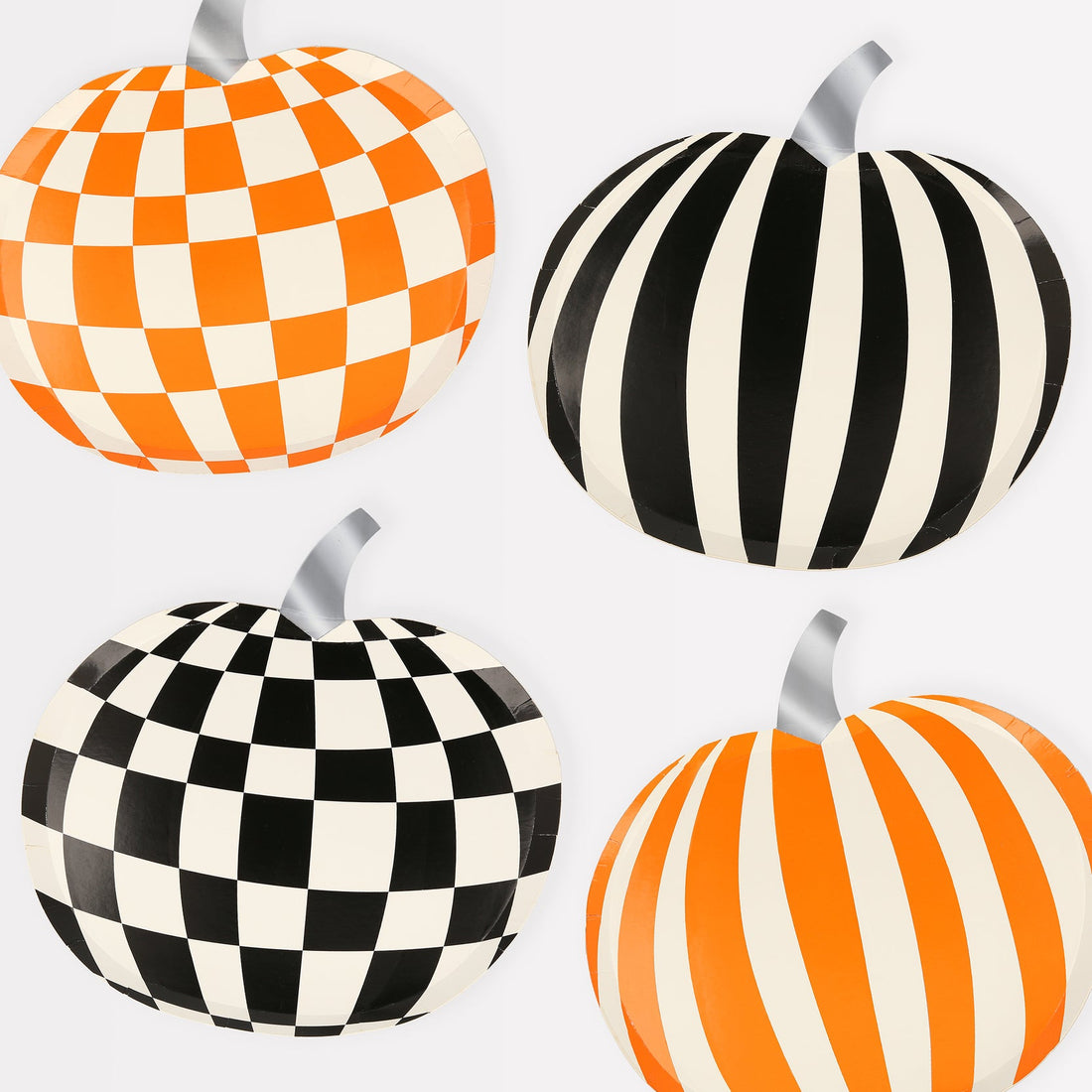 4 pumpkin plates; one orange and white check, one black and white check, one orange and white stripe, one black and white stripe.
