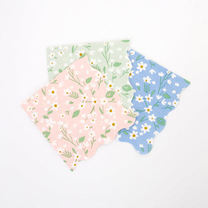 A set of four Ditsy Floral Napkins by Meri Meri with a scalloped edge design.