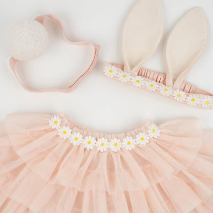 A Peach Tulle Bunny Costume by Meri Meri, with bunny ears on a white surface, perfect for Easter or a bunny costume.