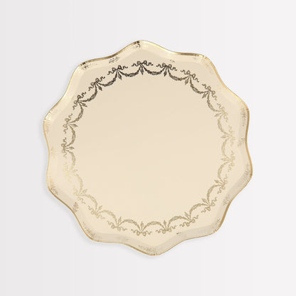 A Meri Meri Ladurée Paris Paper Plate adorned with a shimmering gold foil on a pristine white surface.