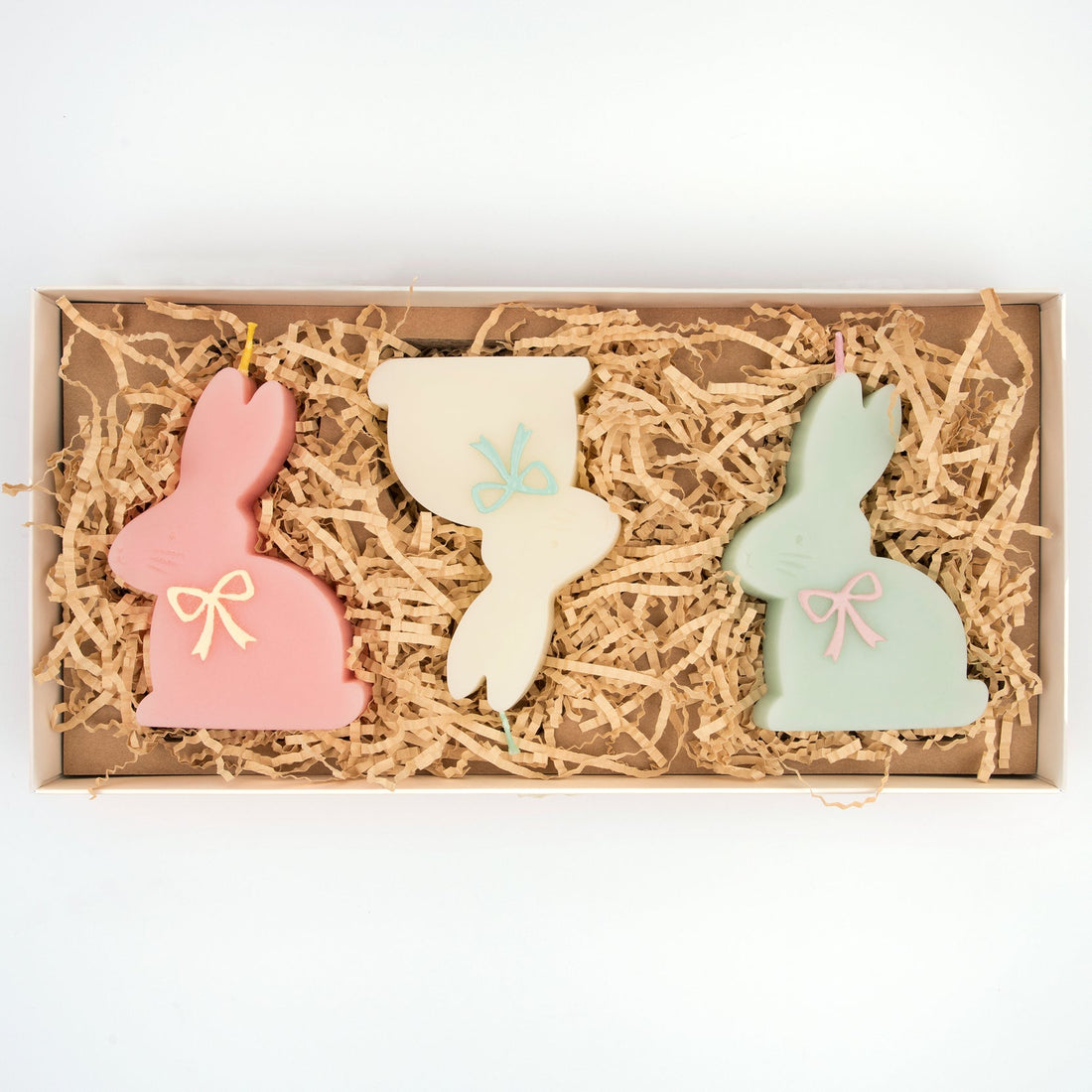 Bunny shaped candles in packaging. 