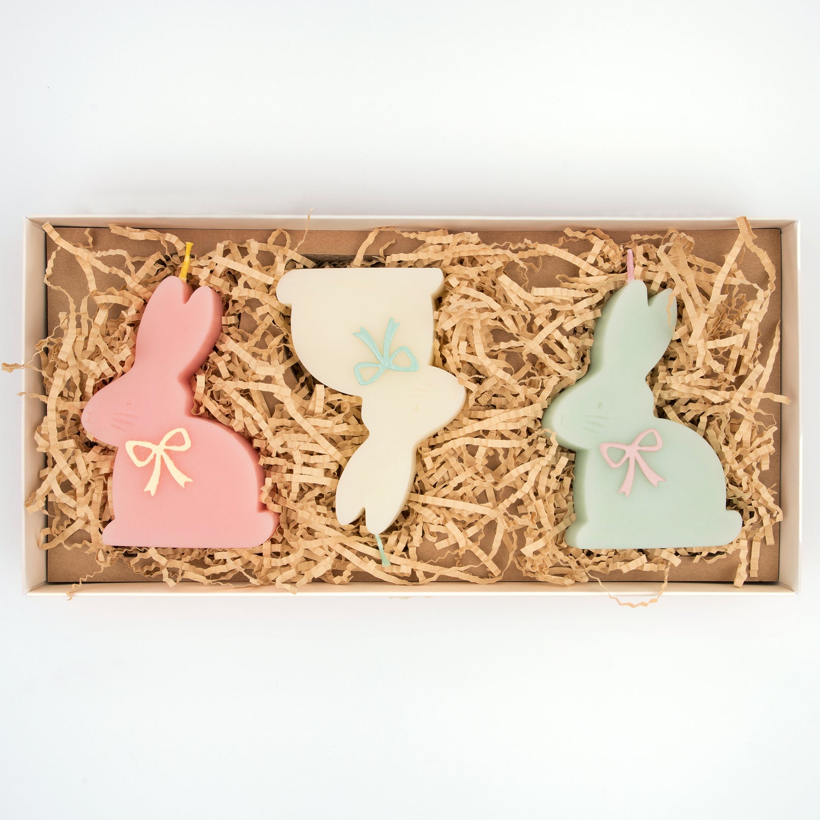 Bunny shaped candles in packaging. 