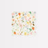 A white scalloped beverage napkin with a floral pattern featuring pastel colors and strawberries against a white background. 