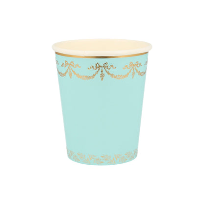 A blue and Meri Meri Ladurée Paris cup with gold trim.