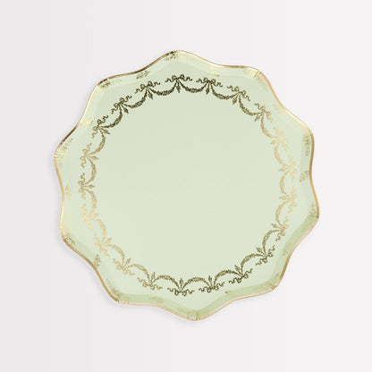A green and gold plate with a gold border is reminiscent of the exquisite Meri Meri Ladurée Paris Paper Plates adorned in elegant gold foil.