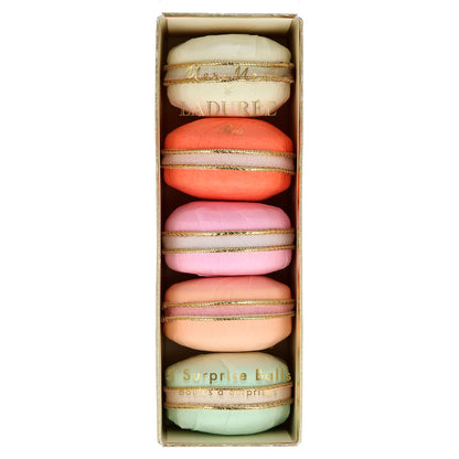 Four Ladurée Paris Macaron Surprise Balls in a box, created by Meri Meri, on a white background.