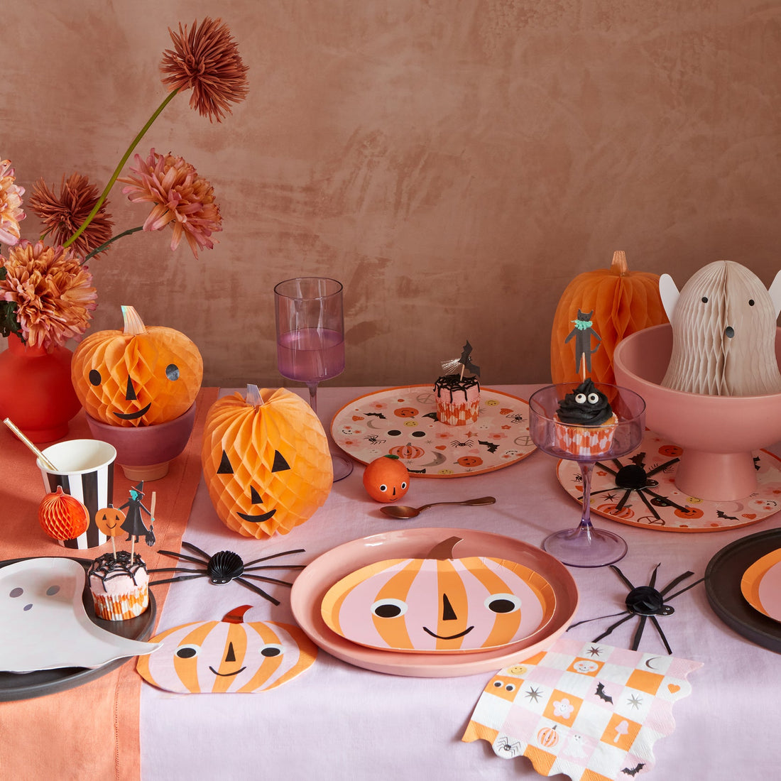 table set for a party featuring the Pink and Orange Stripy paper cup