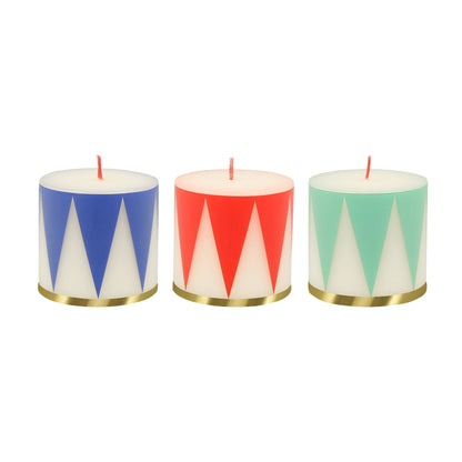 Drum Candle set of 3 candles have traditional Nutcracker designs of red, green and blue, with gold details and red wicks.