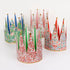 Colorful paper crowns with festive designs on a white background.