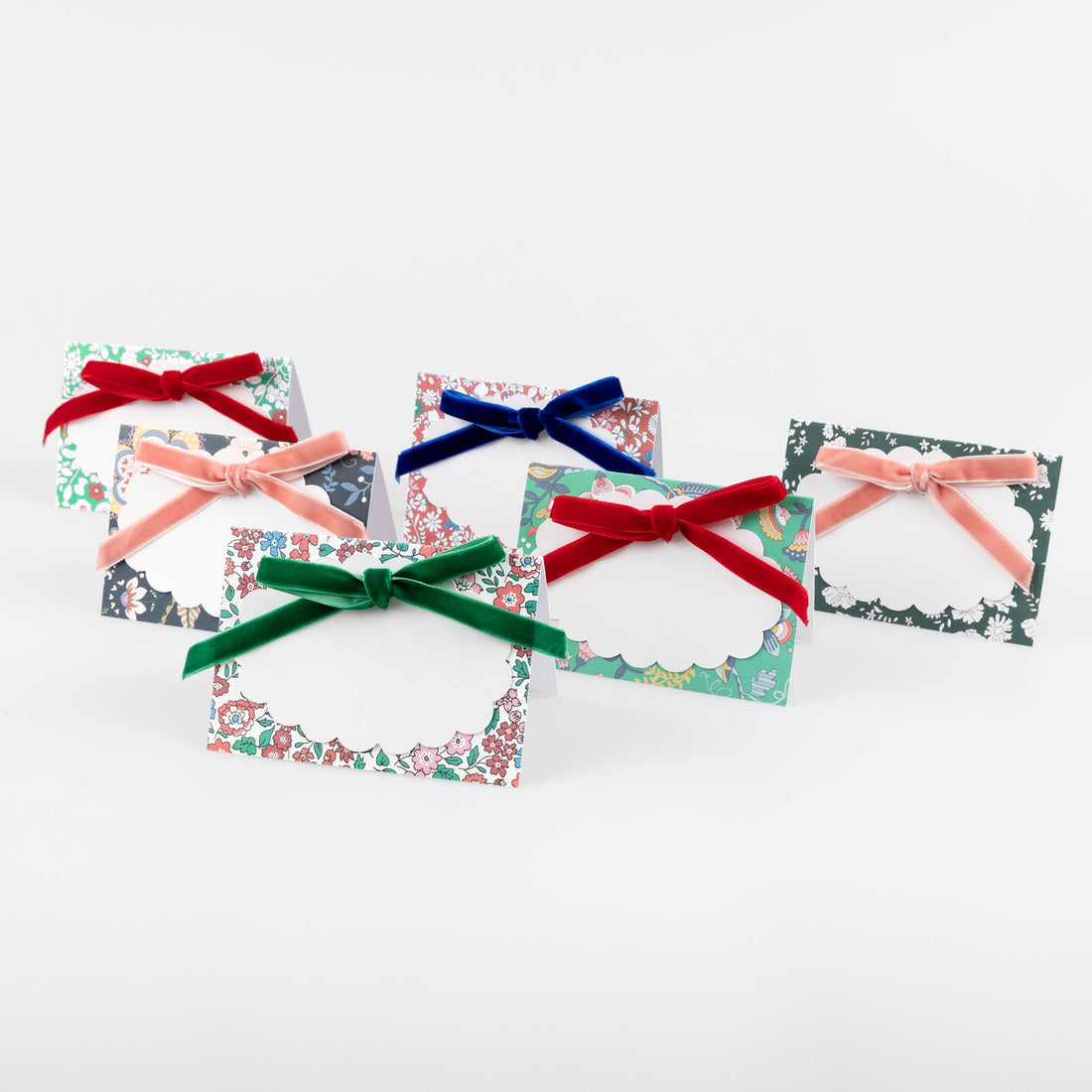 Five decorative cards with colorful bows on a white background