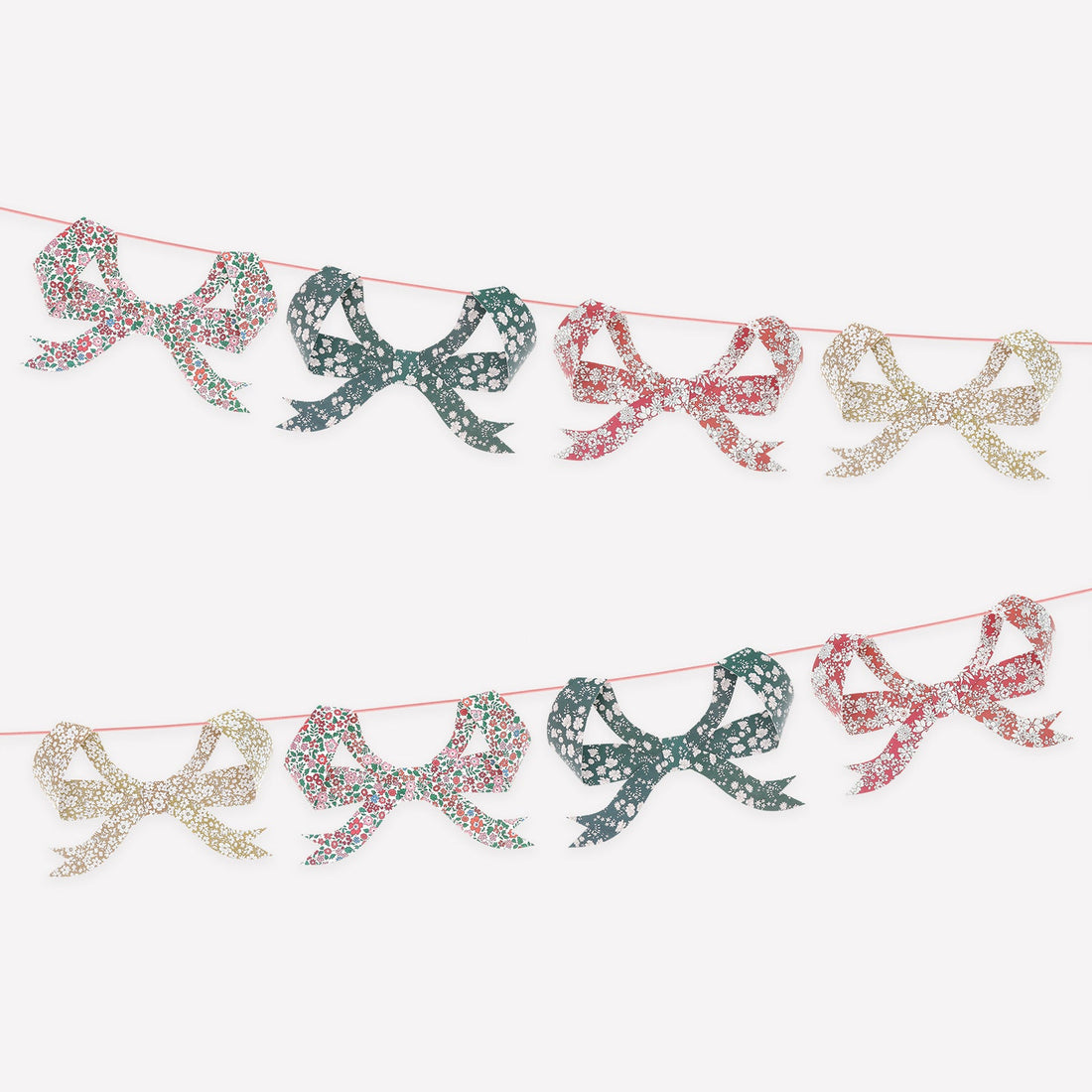 Decorative garland with Liberty of London printed bows on a white background.