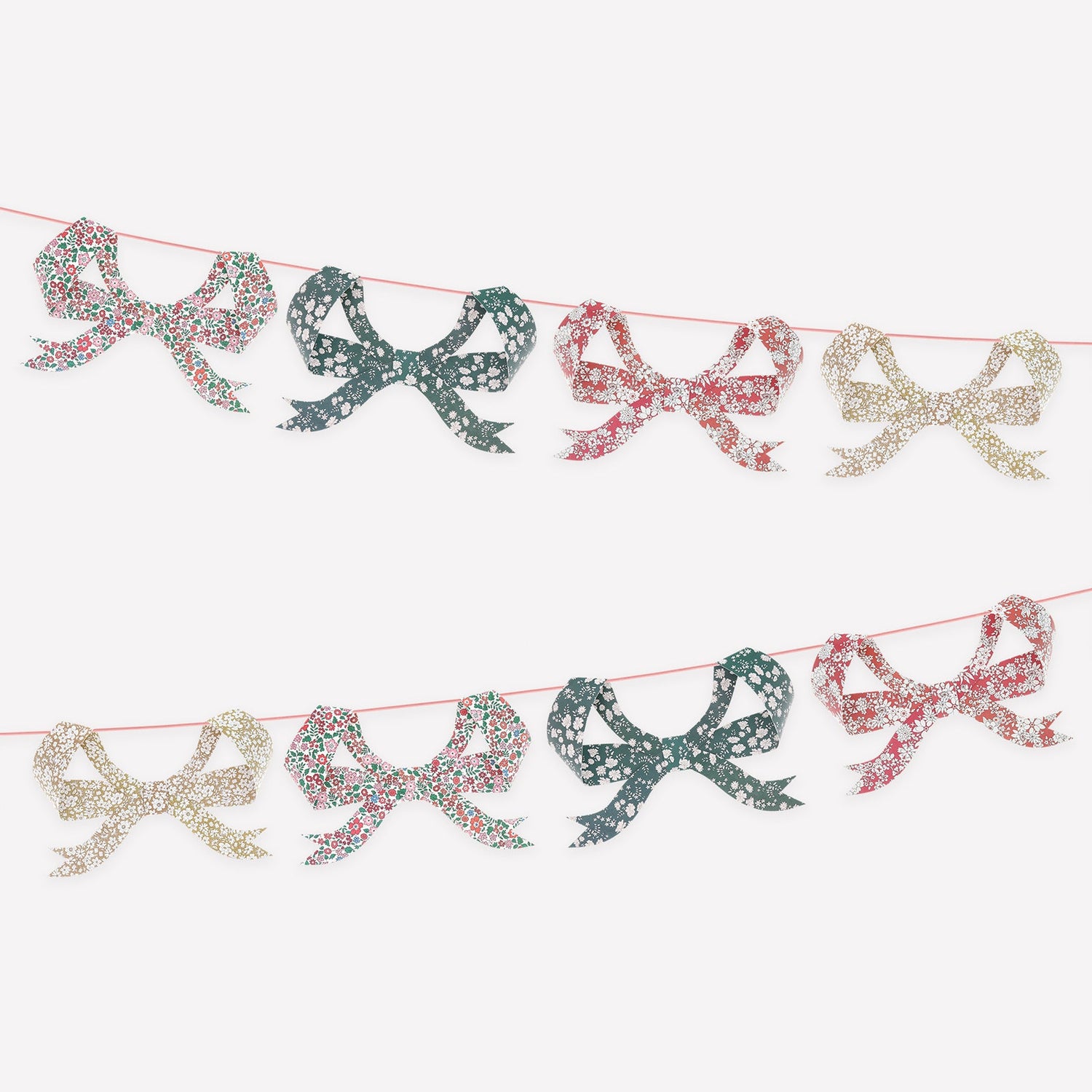 Decorative garland with Liberty of London printed bows on a white background.