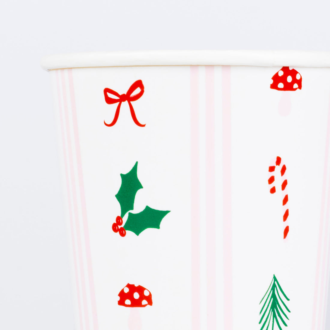 White cup with Christmas-themed illustrations on a white background.