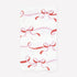 Paper napkin with a pattern of pink and red ribbons on a white background. 