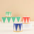 Drum Candle set of 3 candles have traditional Nutcracker designs of red, green and blue, with gold details and red wicks.
