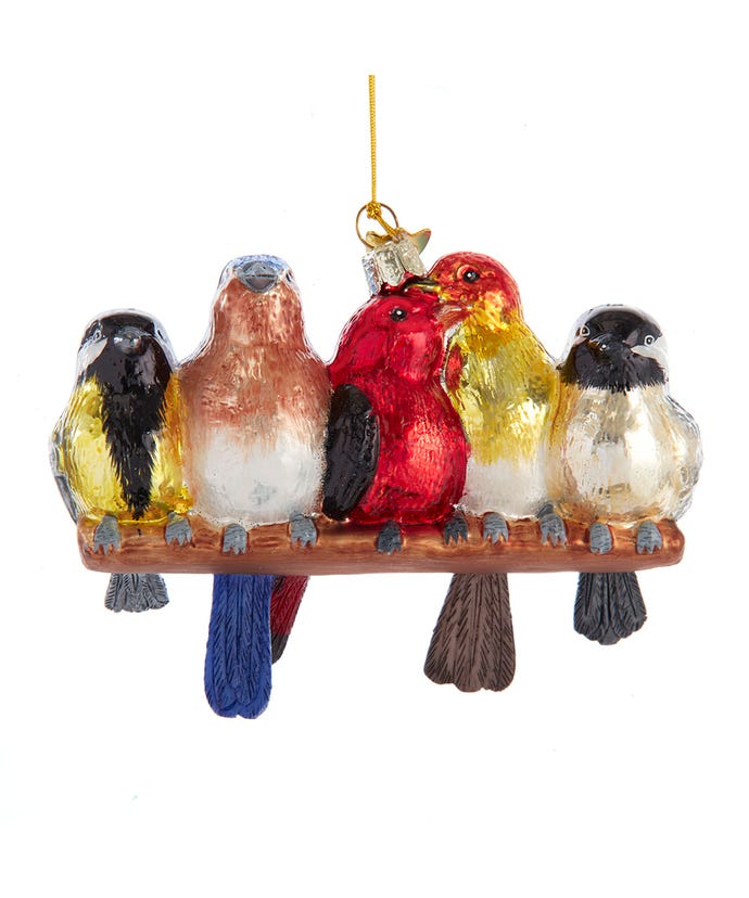 A glass ornament featuring five colorful songbirds on a branch.