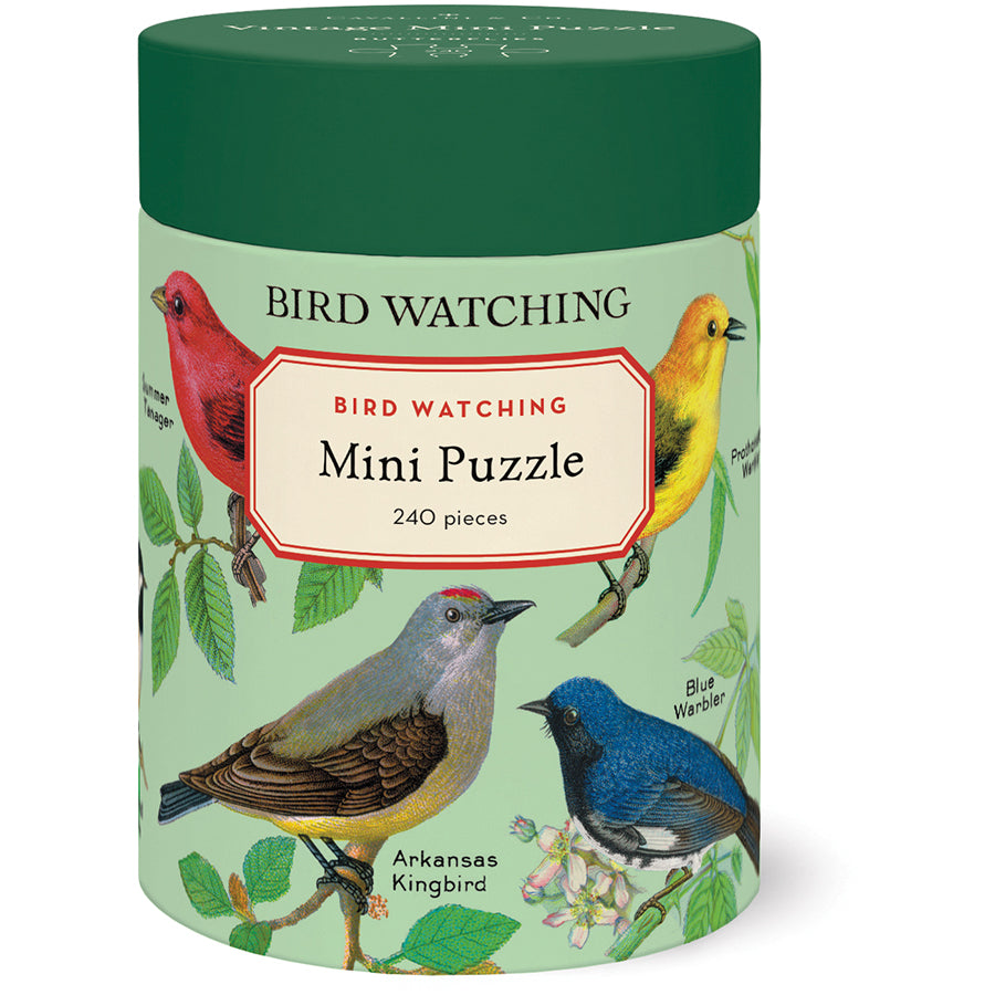 Jigsaw puzzle packaging with bird illustrations on a green background