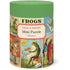 A cylindrical puzzle box with frog illustrations and text on a white background