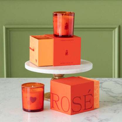 Rosè Valentine Candles next to their decorative boxes.