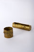 Two brass containers with tree bark design on a white background.