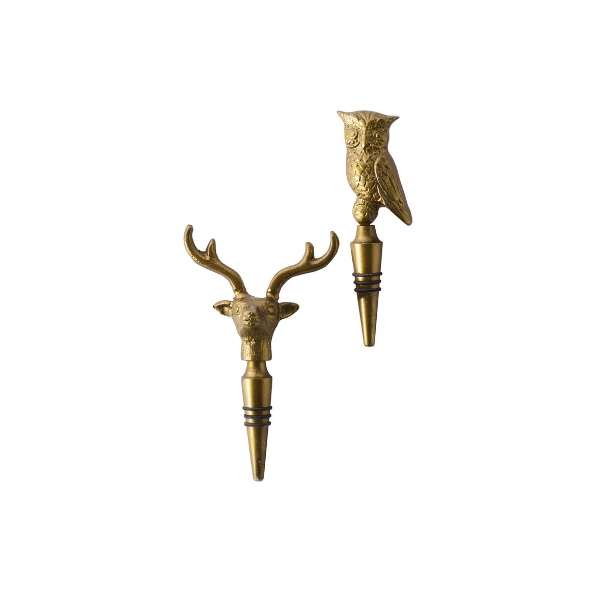 Two gold bottle stoppers shaped like a deer head and an owl on a white background.