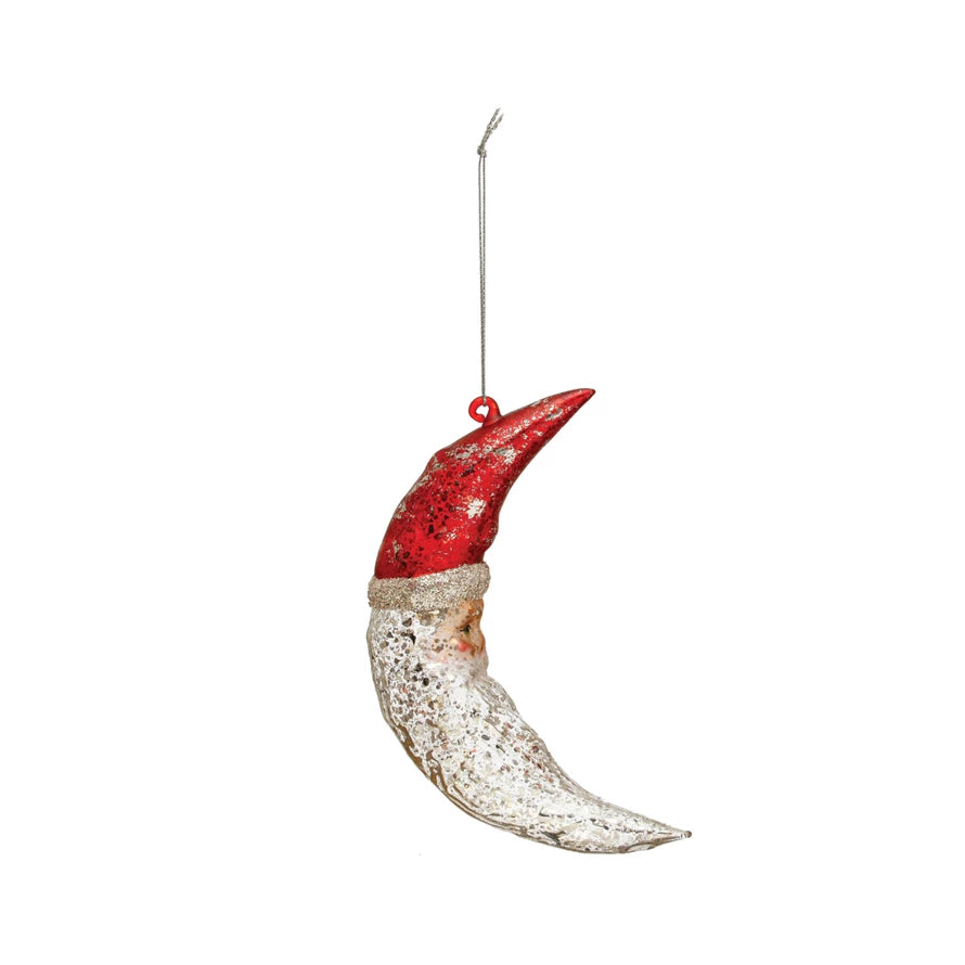 Decorative ornament shaped like a crescent moon Santa with a red top on a white background