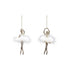 Two ballerina ornaments with white feathers on a white background