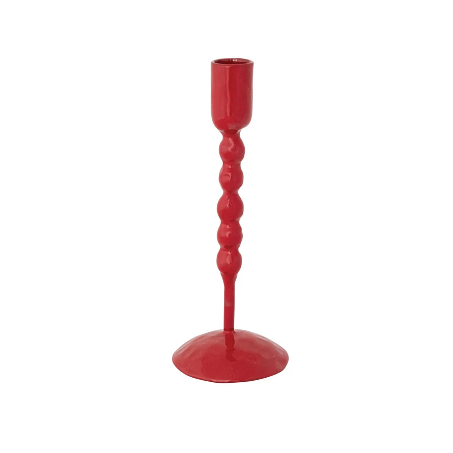 Red candle holder on a white background.