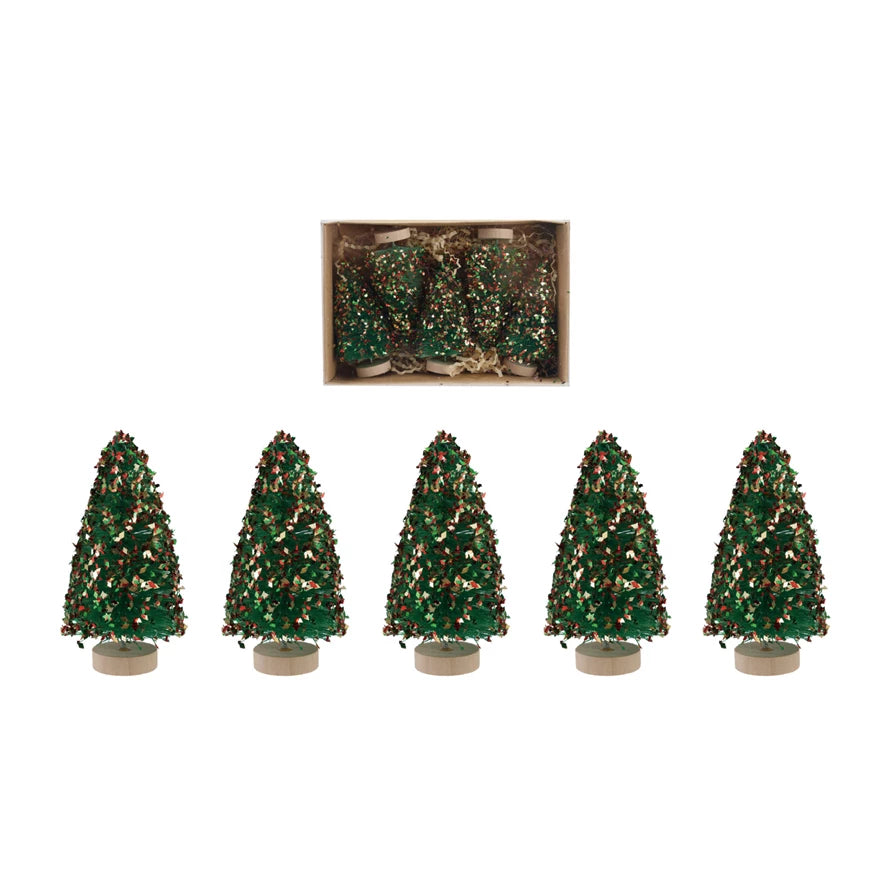 Set of five small glittery sisal trees with a box in the background on a white background.