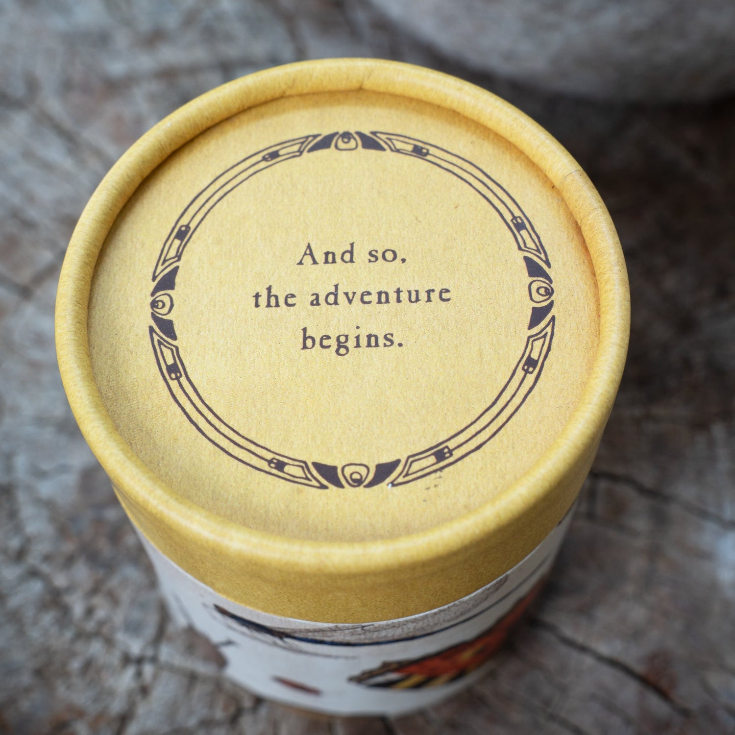 Cylinder with inspirational quote on the top.