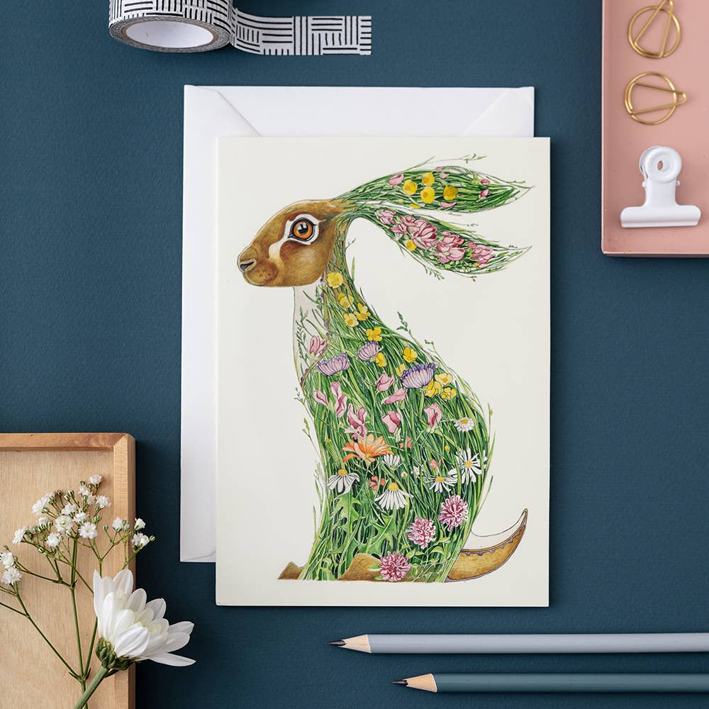 A high-quality Hare in a Meadow Card featuring a bunny surrounded by watercolor painted flowers - perfect for thank-you cards. (Brand Name: The DM Collection)