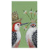 Two illustrated woodpeckers with plants and flowers adorning their heads against a green background are featured on Paper Products Design First Date guest towels.