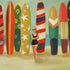 Woman in a swimsuit standing beside a colorful collection of surfboards, captured in a fine art print by Janet Hill featuring The Sea Queen Small Art Print.