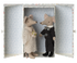 Two Maileg Wedding Mice Couple in Box figurines dressed in wedding attire standing inside a box decorated to resemble a room.