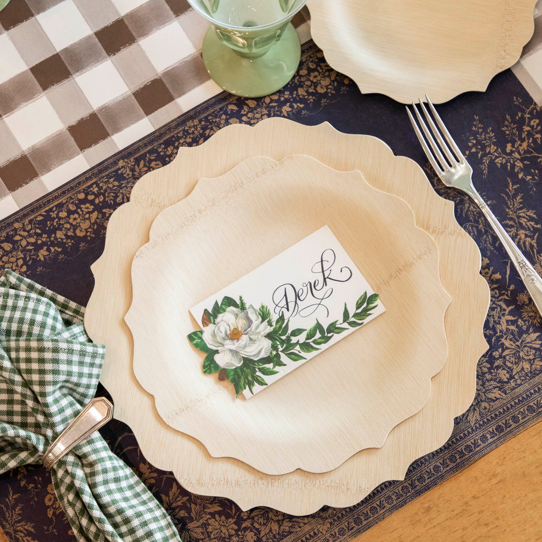 A compostable table setting with Veneerware Fancy Bamboo Plates certified by USDA organic, Bambu Wholesale napkins, and place cards.