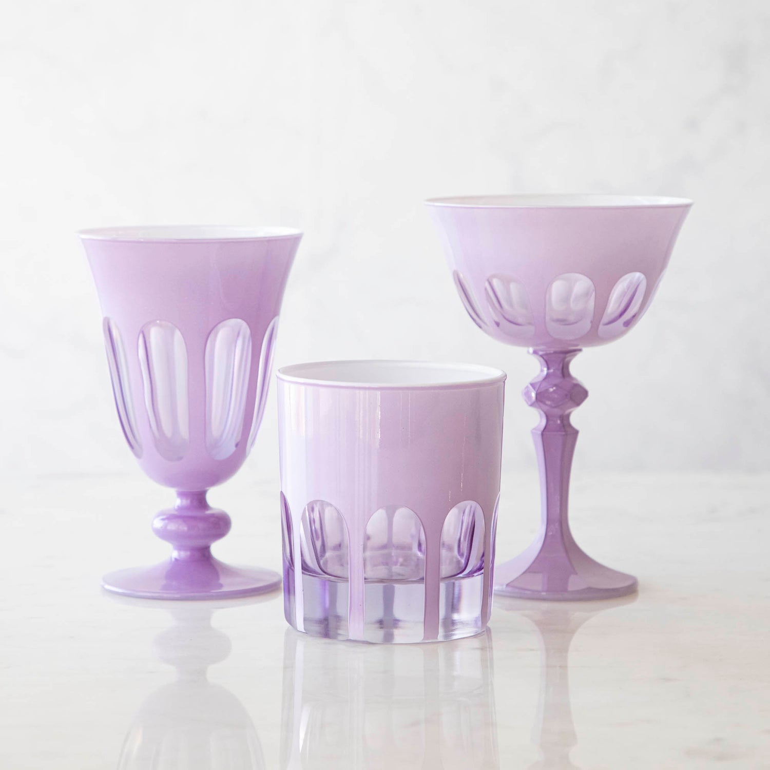 Three Set of 2 Rialto Lupine (Light Purple) Glasses by SIR/MADAM on a marble table.