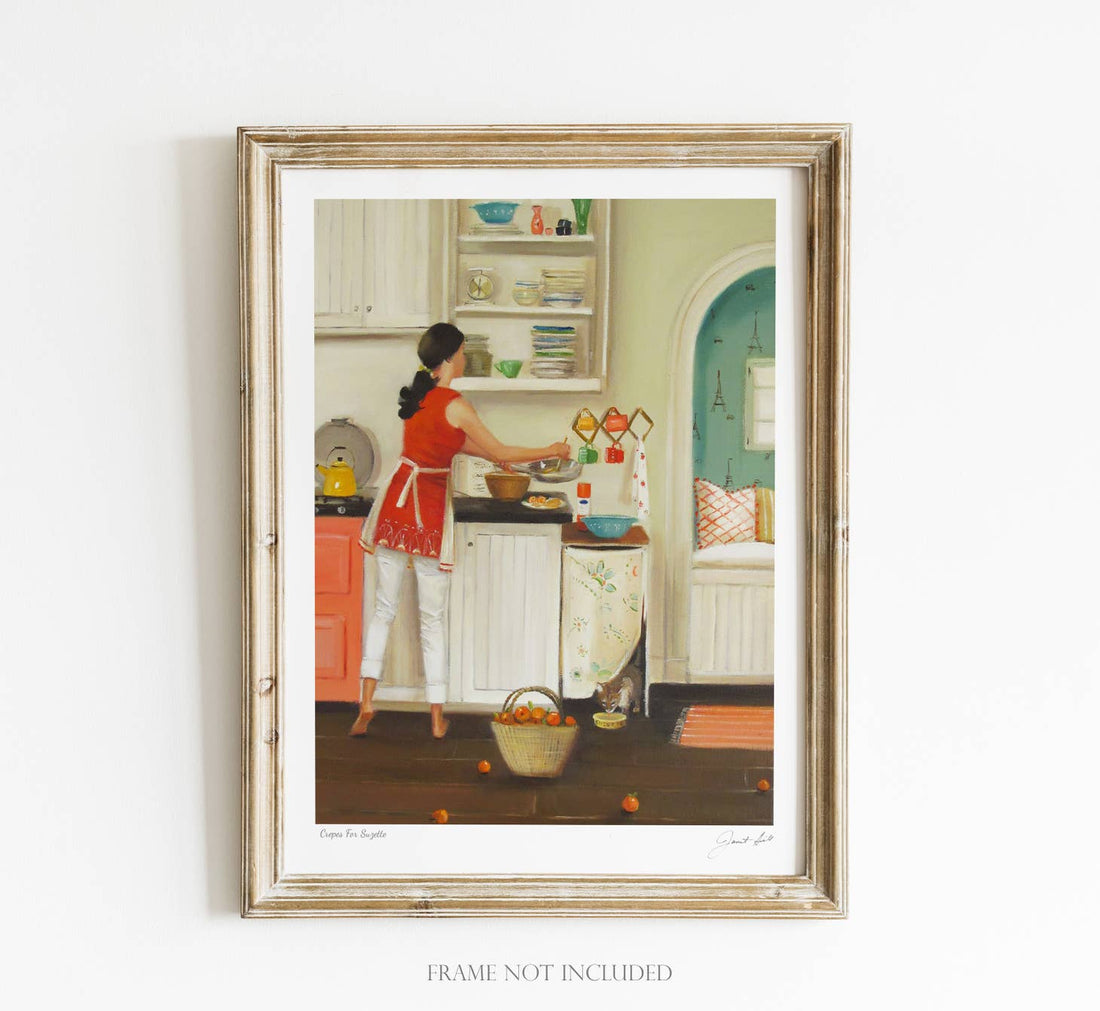 A framed painting, printed on heavyweight matte fine art paper by Janet Hill, of a woman standing in a kitchen, preparing food on a countertop.