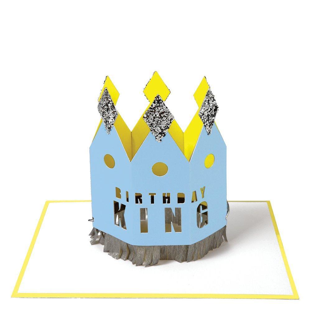 Blue Birthday King Crown Card with &quot;happy birthday king&quot; text and silver crepe paper accents on a white background, by Meri Meri.