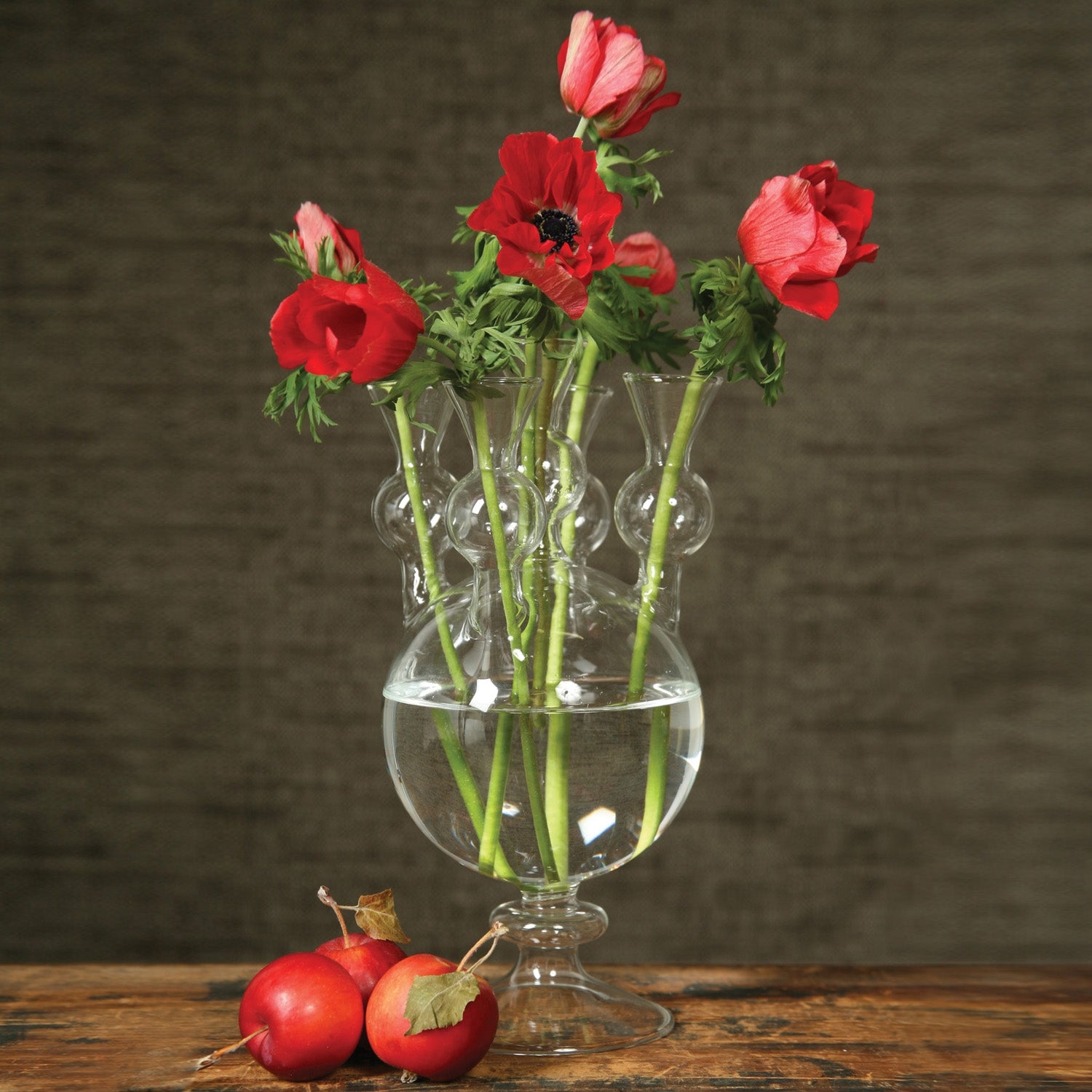 A group of Tulipiere Vases by HomArt on a table.