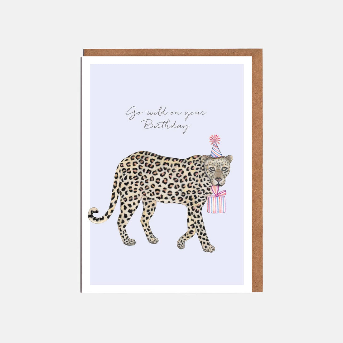 A Leopard Birthday Card featuring an illustration of a leopard carrying a gift, printed on FSC certified paper by Lottie Murphy.