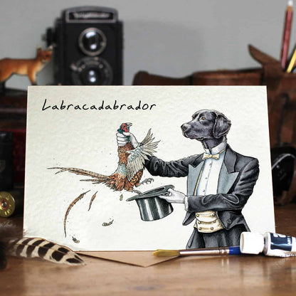 A Labracadabrador Card for dog lovers, featuring a delightful image of a dog and a pheasant. Perfect for any occasion, this card is blank inside for a personalized message. (Brand: Hester &amp; Cook)