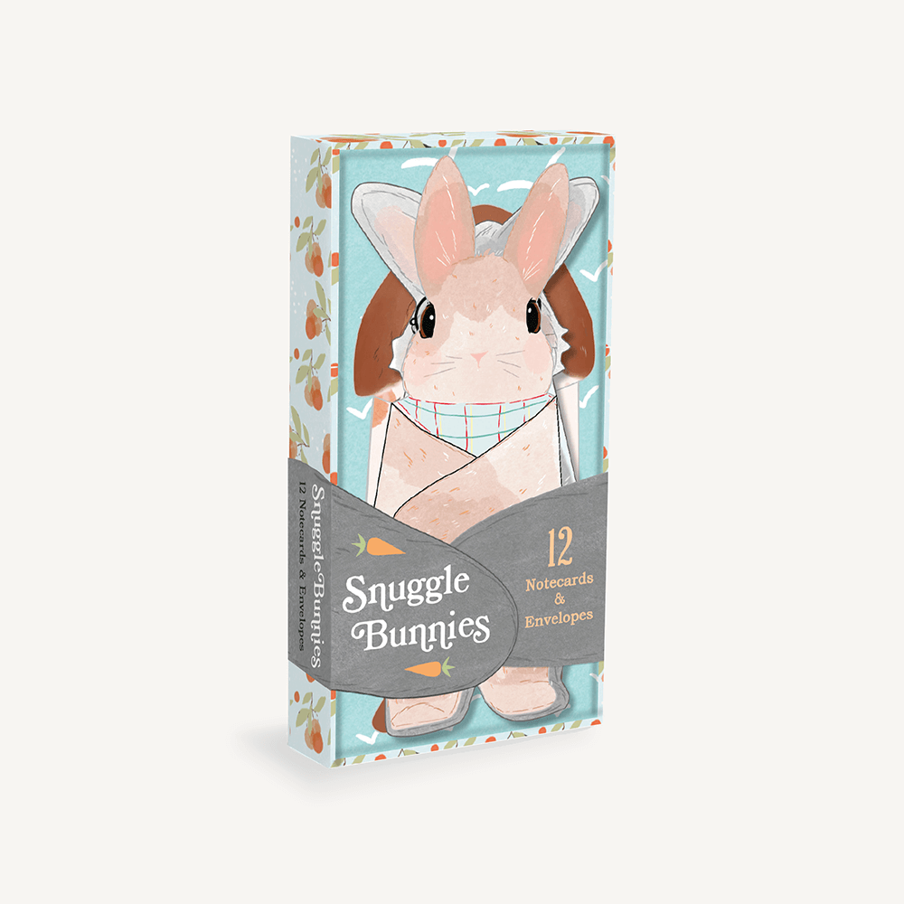 A box of Snuggle Bunnies greeting cards featuring bunny artwork on the front.