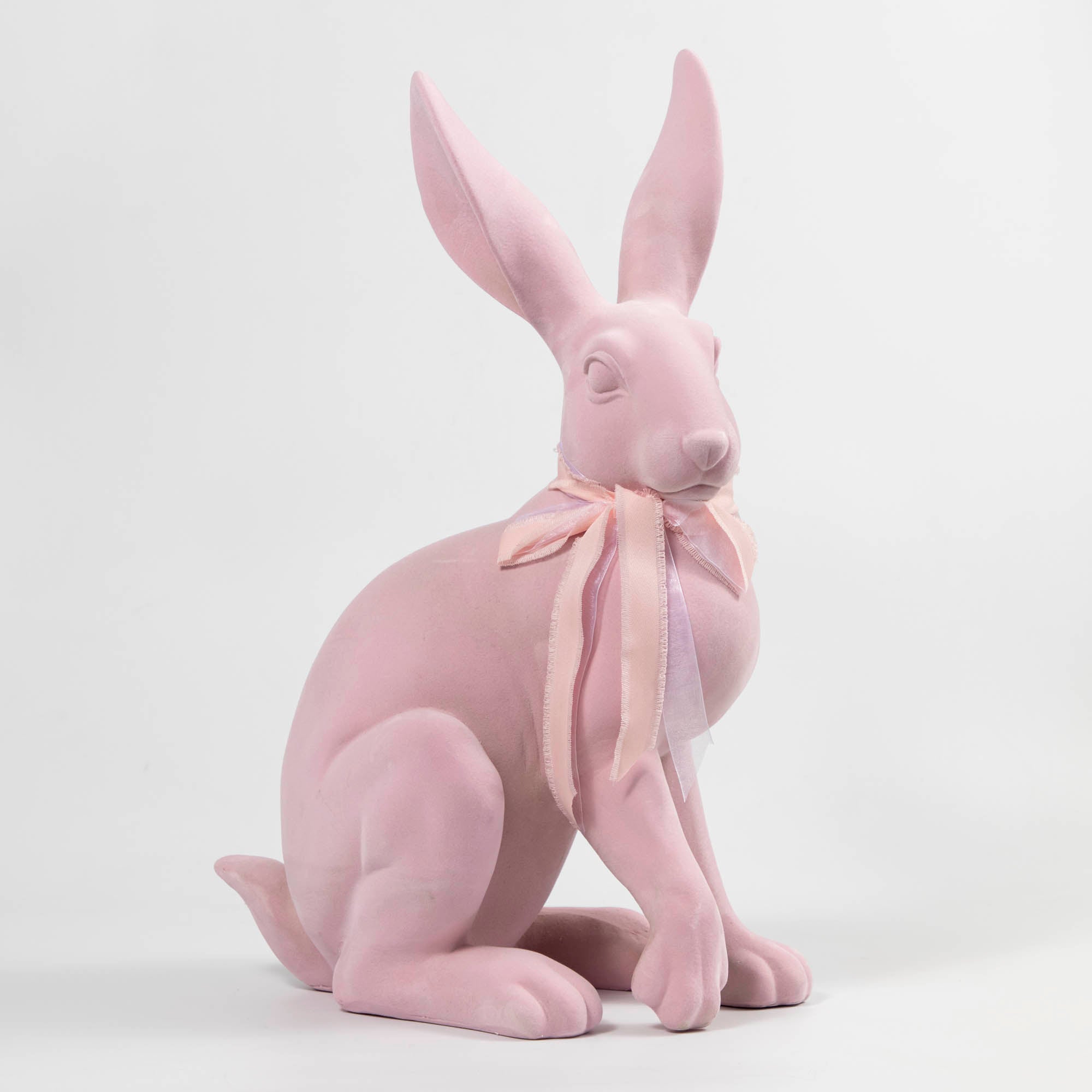 A sculpture of a White &amp; Pink Flocked Bunny with a pink bow, perfect for Easter decorations, made by Glitterville.