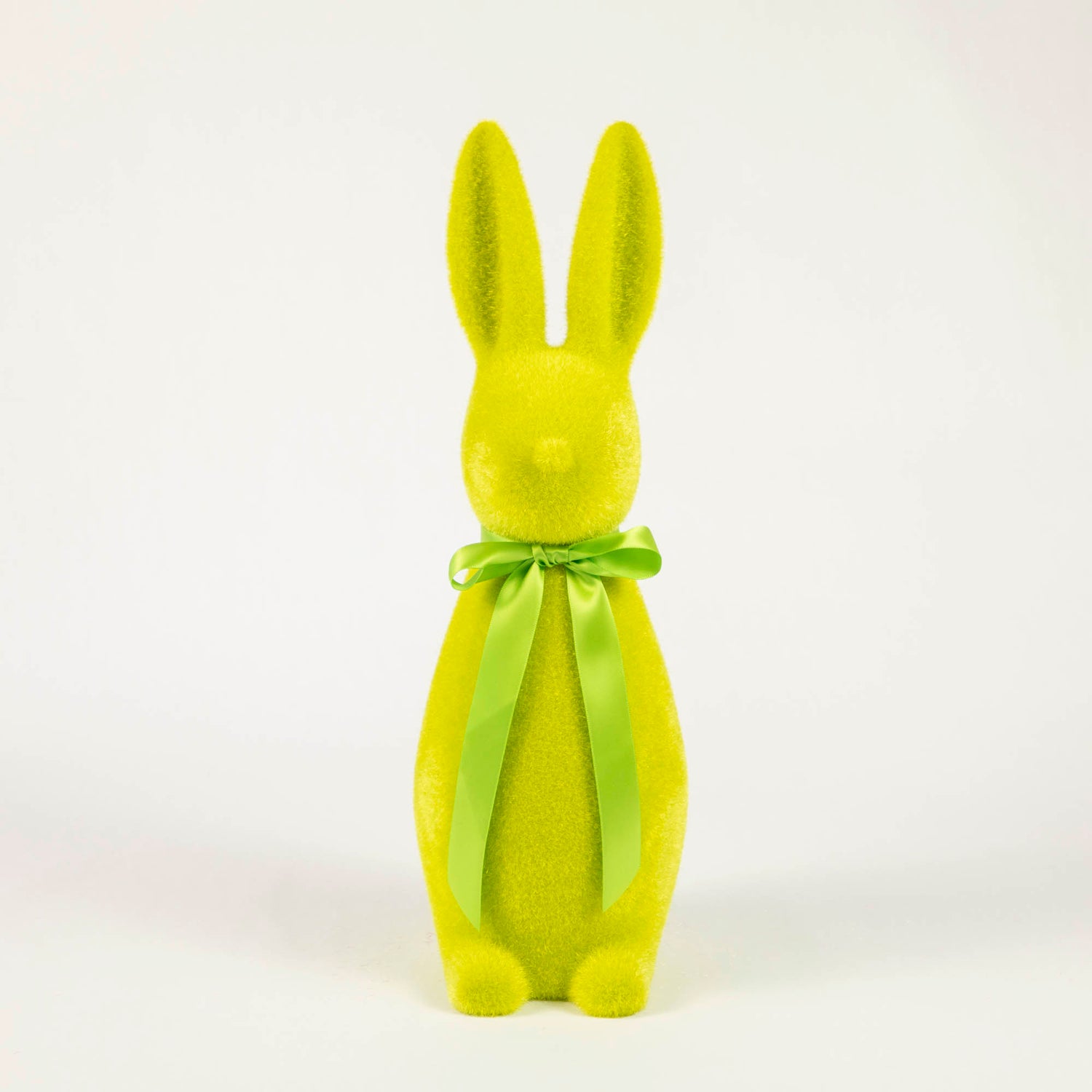 An adorable Glitterville bunny wearing a green bow, perfect for Easter celebration or as a delightful gift.