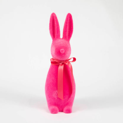 A Medium Flocked Button Nose Bunny by Glitterville with a red bow on a white background, perfect for Easter celebrations.