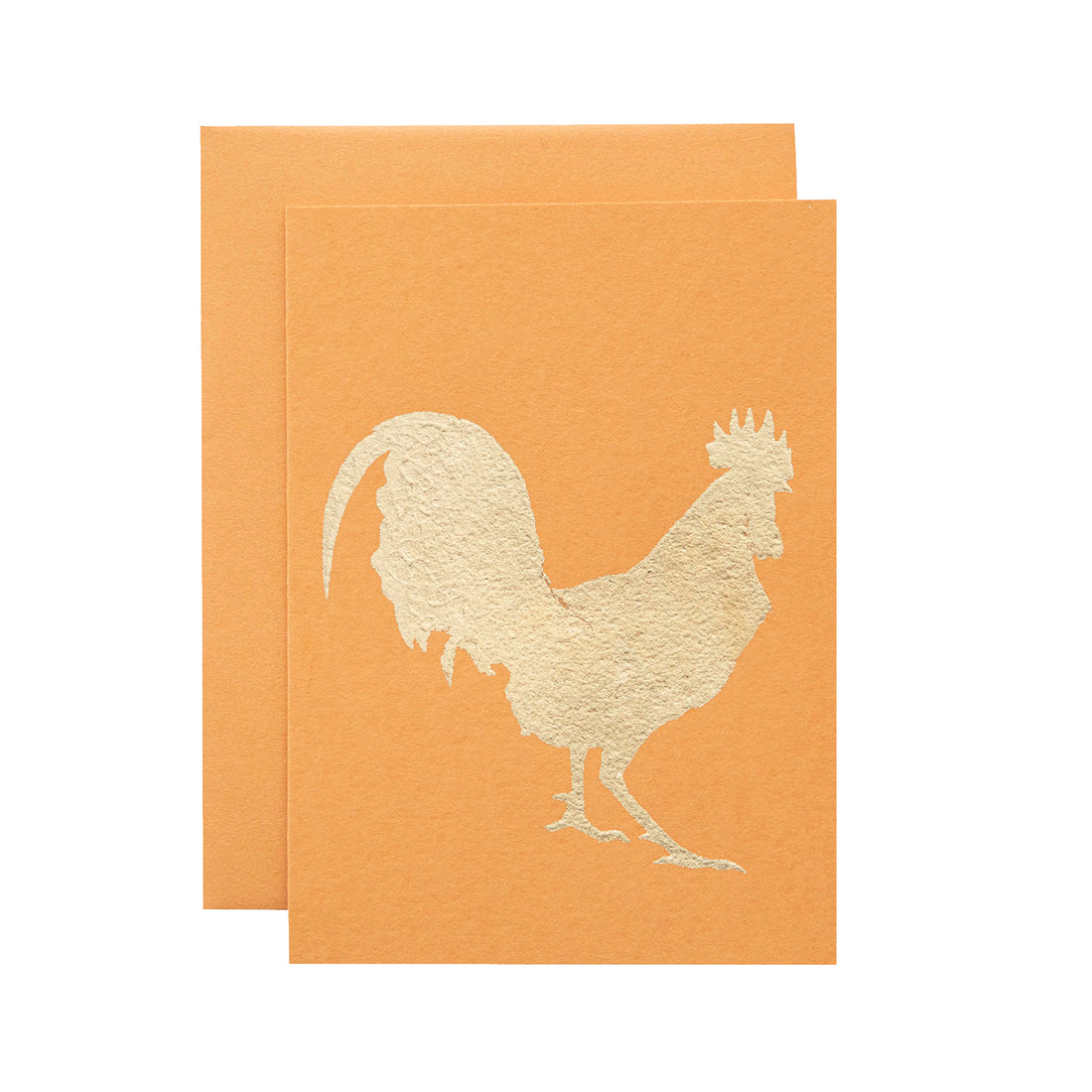A bright orange card featuring the silhouette of a rooster in solid gold leaf.